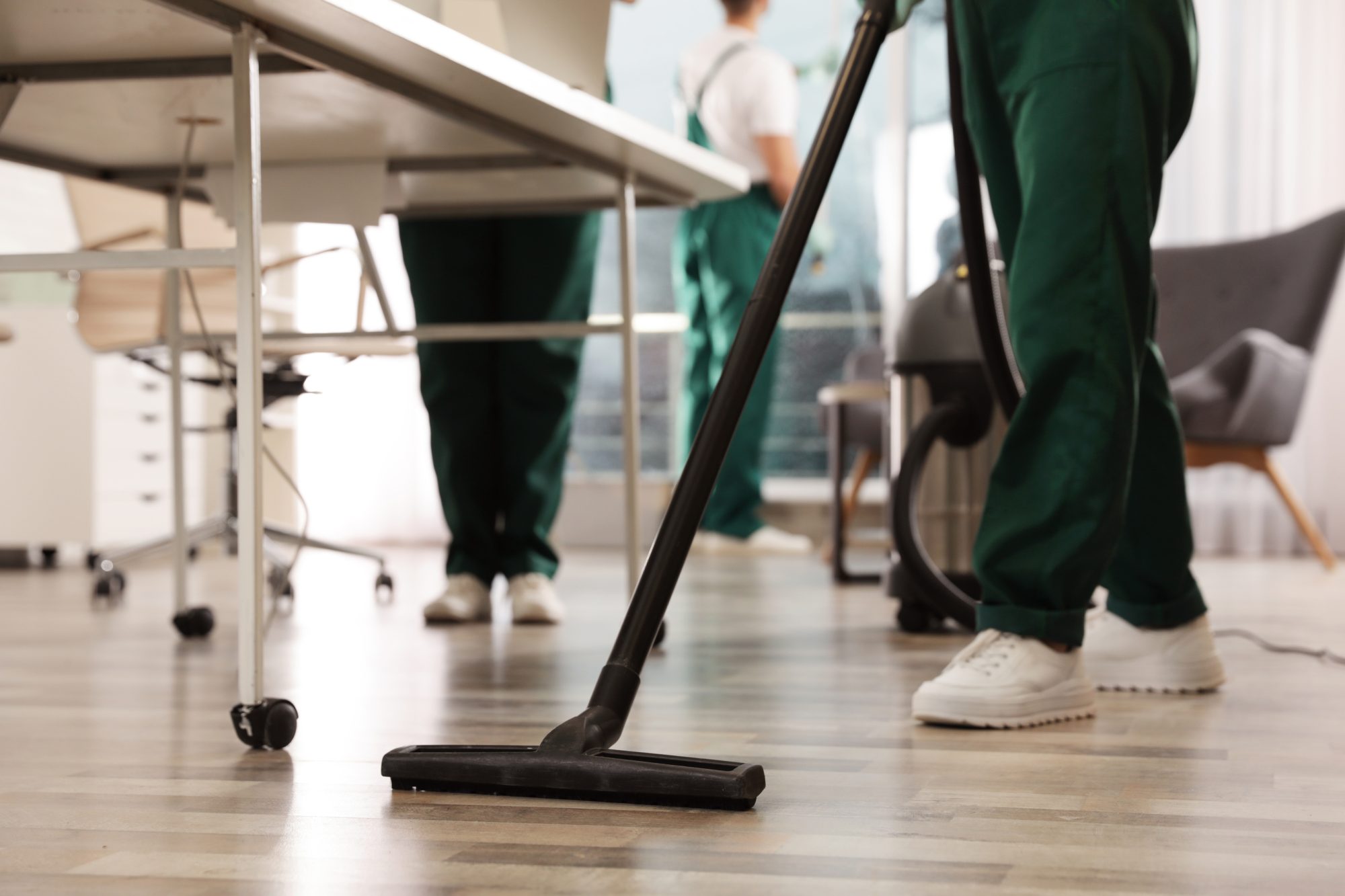 Professional janitor cleaning floor