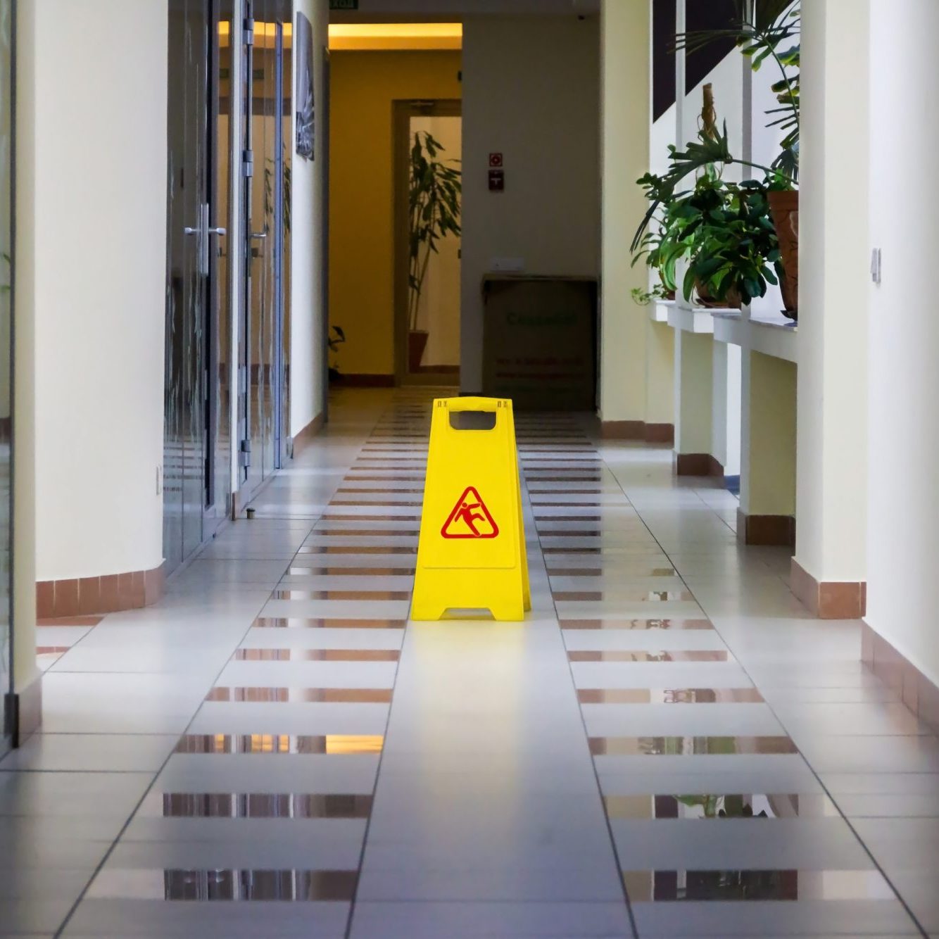 Cleaning of office. Sign wet floor